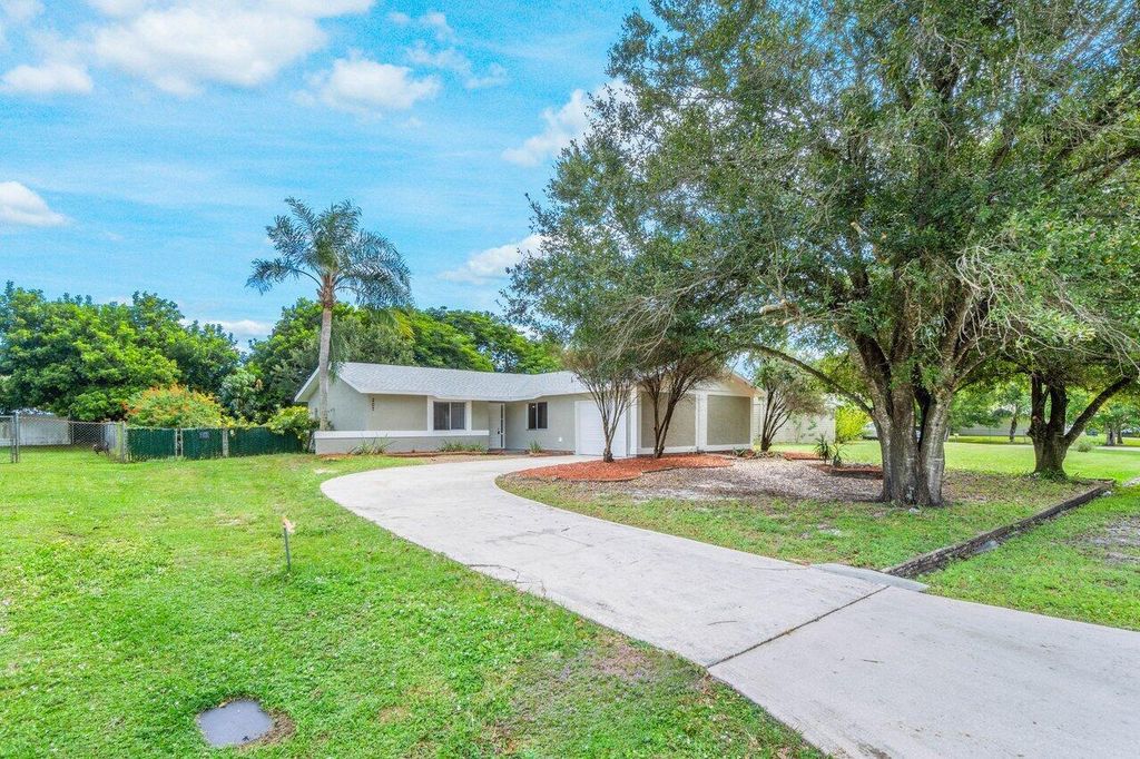 Photo of 207 SW Homeland Road, Port Saint Lucie, FL 34953 (MLS # R10931287)