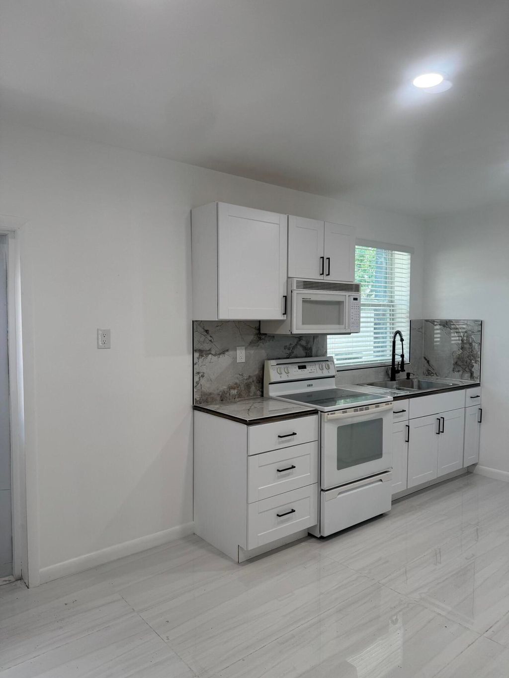 Photo of 4591 Purdy Lane #8, West Palm Beach, FL 33415 (MLS # B26031089)