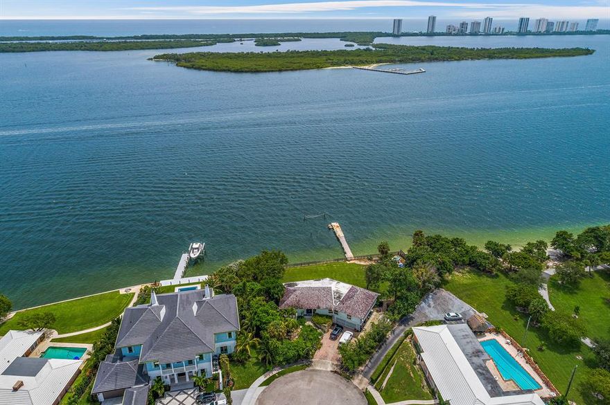 First time ever available! Unique property on private cul-de-sac with 201' of frontage on Lake Worth. Only minutes from the Palm Beach Inlet this property has East exposure and captivating panoramic views.
