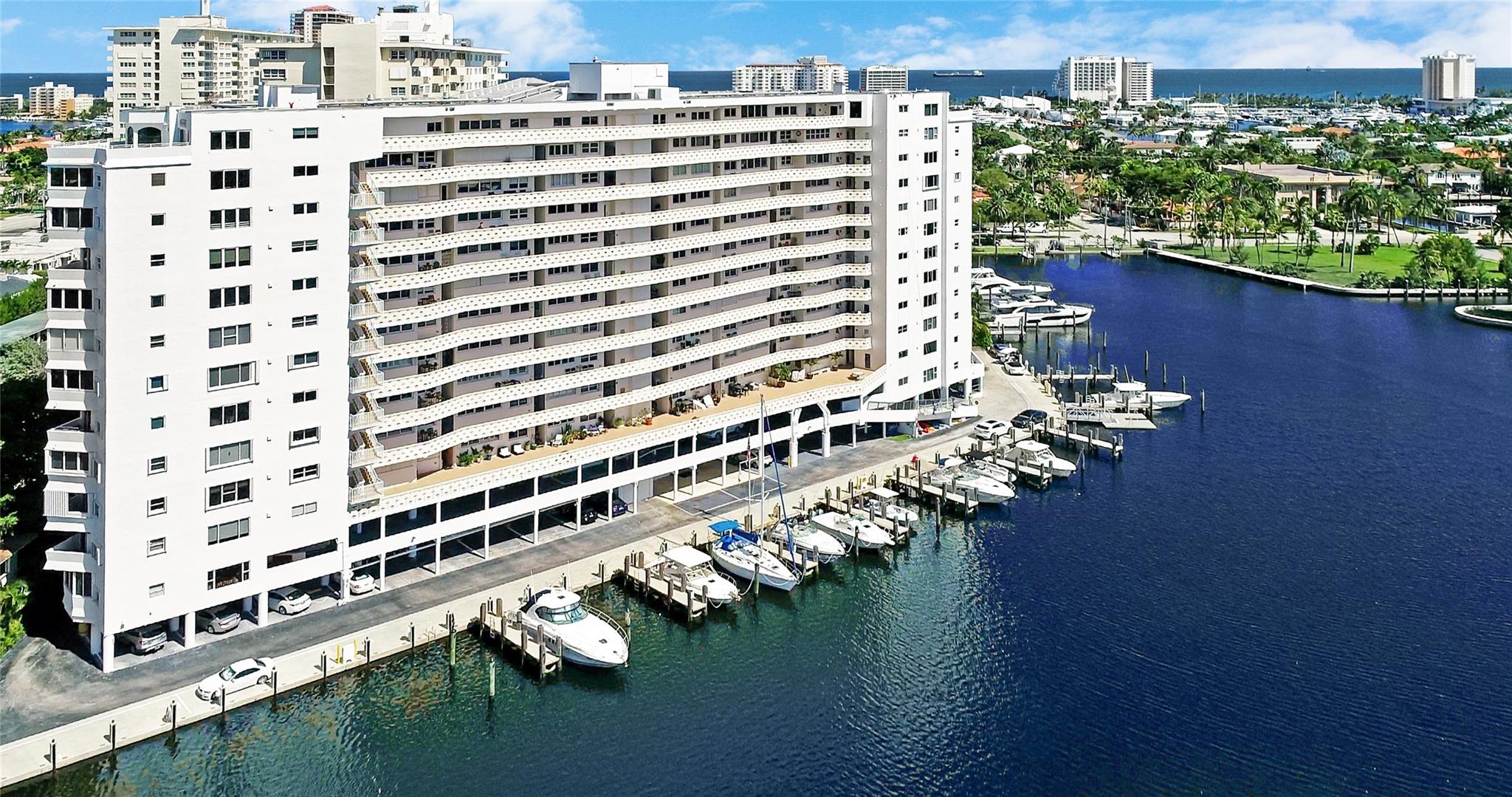 Amazing Views with immediate dockage for your boat. This magazine quality total renovation of the 4th floor end unit has views in 3 directions. Water and tree top view in daylight. Lit Skyline at night. Chef inspired custom kitchen with tons of storage. 2 Large Master Suites one w/dedicated waterfront balcony. 3rd Bedroom nestled in the trees. Recessed lighting throughout enhances the light, bright finishes of this fresh remodel. Wood plank look Porcelain Tile Floors. The historic Four Seasons is standing tall with all 40 and 50 year inspection points addressed. Reserves in place. Just completed 1yr+ exterior refurbish project. Dock to 50+ available now @ $11/ft/month. Any size dogs welcome. Come enjoy the Las Olas lifestyle in this brand new, stand-out, waterfront condo unit
masterpiece.