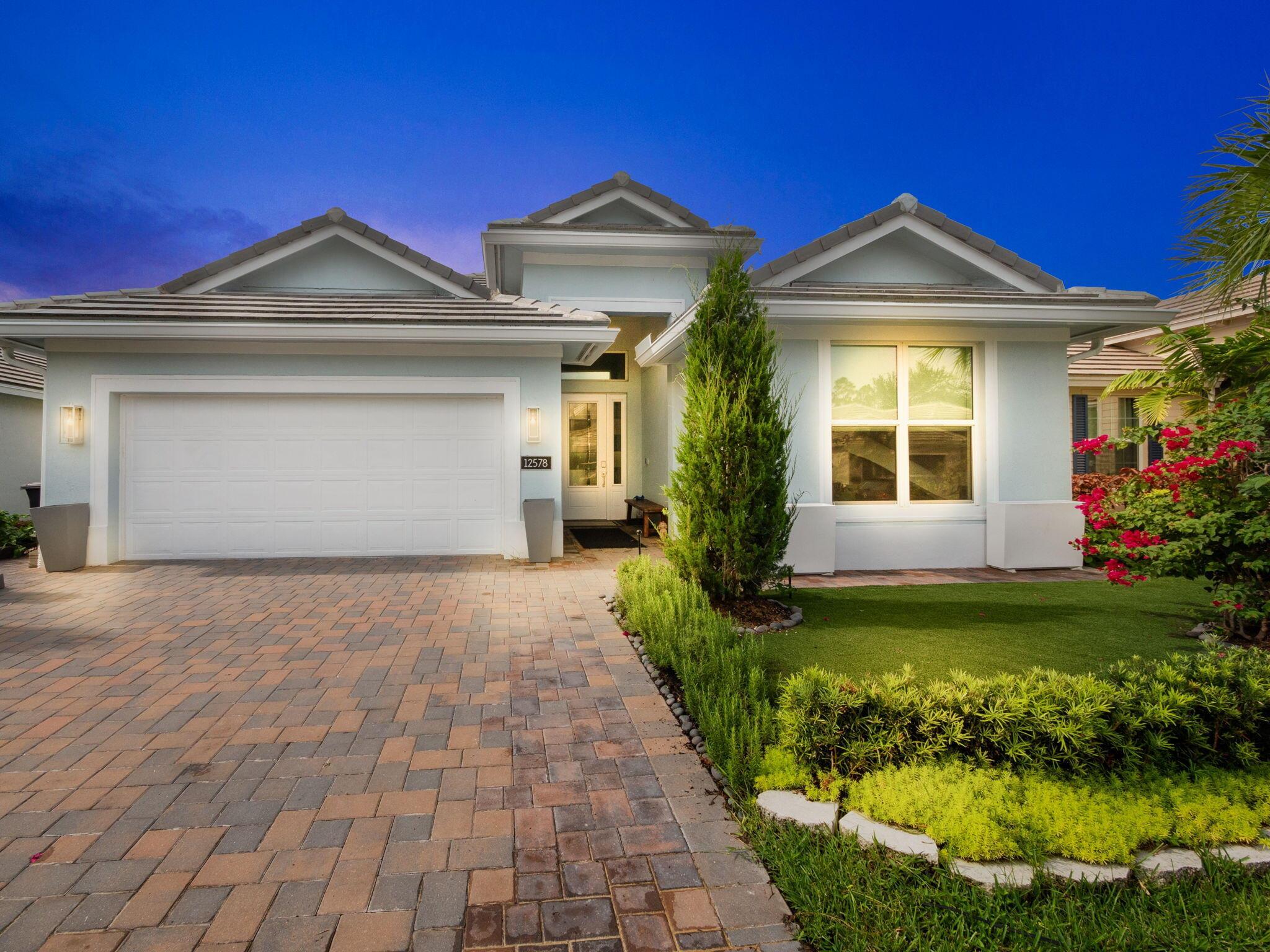 Welcome to your ideal home in the prestigious LakePark at Tradition, where luxury meets tranquility in this breathtaking 3-bedroom, 2-bathroom lakefront property. Nestled in one of the most sought-after communities, this home offers a harmonious blend of modern elegance and serene living. Upon entering, you'll immediately notice the expansive, open-concept floor plan, flooded with natural light, and beautifully designed to enhance both comfort and style. The living spaces are adorned with high-end finishes, including stunning quartz countertops, sleek cabinetry, and contemporary fixtures, all contributing to an atmosphere of refined sophistication.