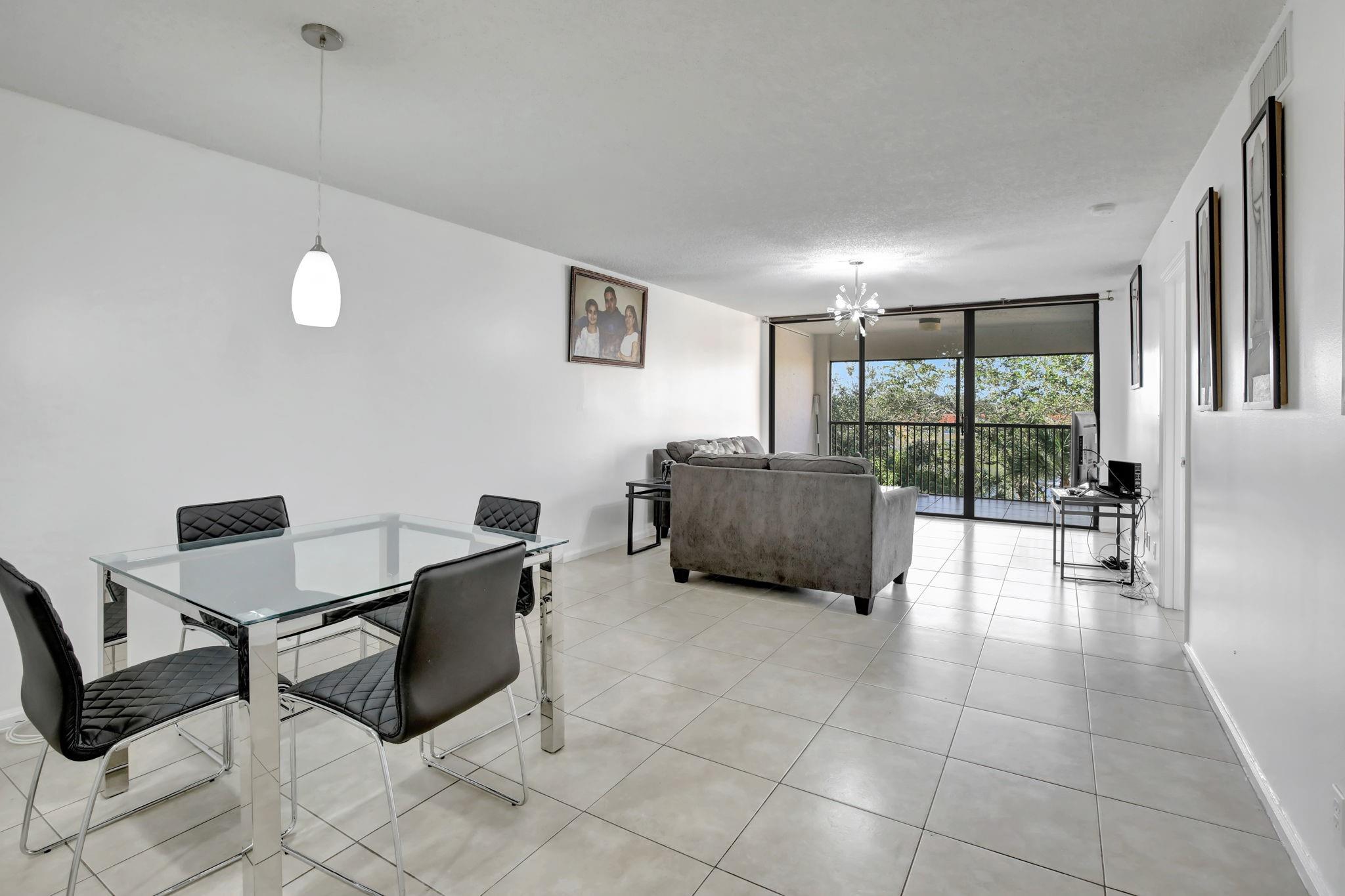 Lovely, well maintained, 2 bed/2bath ALL AGES condo in desirable Jacaranda Heights. With only 66 units in this complex, all inspections complete with a $10,565.00 assessment that the SELLER is paying off in full at closing, you can't go wrong. The water and garden view from the living room and balcony are beautiful. The bedrooms are split for privacy. The community offers a relaxing pool on the lake, a clubhouse, jog/walk path and plenty of parking. Washer and Dryer in unit, 2018 tankless water heater, AC 2009. Great location, close to shops, restaurants and schools. No renting for 2 years then 1 rental allowed per year. Must have 650 credit score.