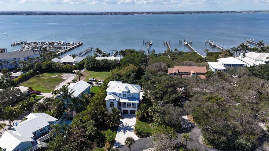 Welcome to 1702 NE Ocean Blvd, a breathtaking waterfront masterpiece in the prestigious Buttonwood neighborhood. This exquisite 4-bedroom, 4-bathroom estate, spanning 3,511 square feet, was crafted in 2018 with the utmost attention to detail and modern luxury.As you step inside, you'll be greeted by the bright and open living spaces, adorned with vaulted ceilings that create an airy ambiance. The gourmet kitchen is a chef's dream, featuring top-of-the-line appliances, sleek countertops, and a stylish breakfast bar. Whether you're hosting a formal dinner party in the elegant dining area or enjoying a casual meal in the cozy dining nook, this home offers versatile spaces for every occasion.Retreat to the master suite, a true sanctuary complete with walk-in closets.