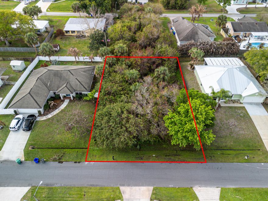 1/4 acre lot - Water and electric are already at the street available so the hard part is basically done. This 10,019 sq ft lot sits in the heart of Sebastian Highlands, one of the most established no-HOA neighborhoods on the Treasure Coast. Build what you want, when you want, without anyone telling you what color to paint your shutters. Septic required, but hey, nobody's perfect. Walk to Barber Street Sports Complex, minutes to the Indian River, boat ramps, beaches, and dining. Lock down your piece of Sebastian.