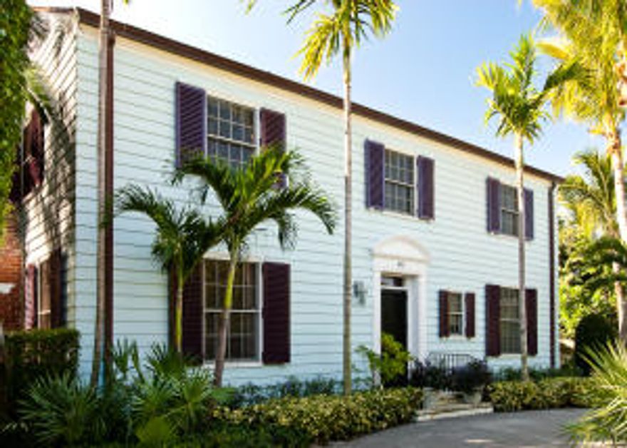 Maurice Fatio designed Monterey Colonial on an oversized lot is enveloped in lush gardens & beautiful dining gardens. Cabanas can serve as guest suites, a large old fashioned coral framed pool welcomes family and friends. Gracious room sizes, great ceiling heights, formal dining room opens to the gardens, gourmet gas kitchen, the house is naturally lit with lots of southern exposed glass porches.  A large heated pool with cabana, garage, full house generator complete this offering.