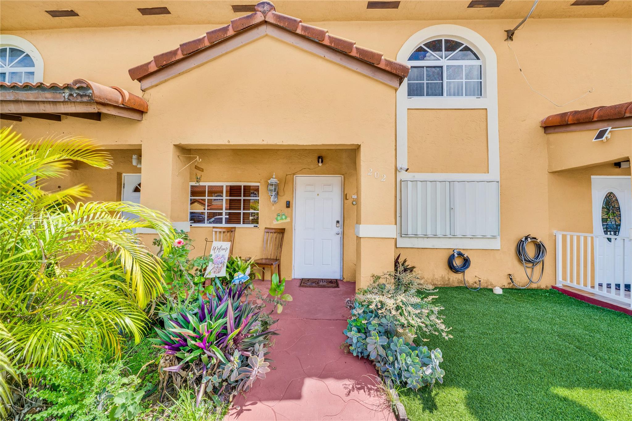 Incredible opportunity to acquire this fantastic 2-bedroom, 2-bathroom townhouse in Hialeah Gardens at an exceptional price! This well-maintained unit includes a washer and dryer. The master bedroom features a walk-in closet. Perfect for first-time buyers or investors as the community allows rentals without restrictions. The community is pet-friendly and has low HOA fees. Conveniently located in the heart of Hialeah Gardens, close to everything: restaurants, shops, schools, highways, and more. Schedule a visit today! It won't last long on the market! Buyer agent to verify ALL HOA information