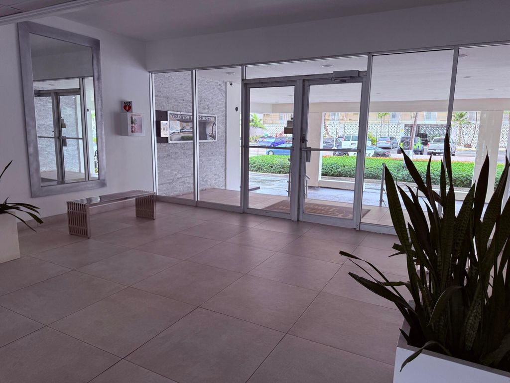 Photo of 401 Golden Isles Drive, Hallandale Beach, FL 33009 (MLS # B26010477)