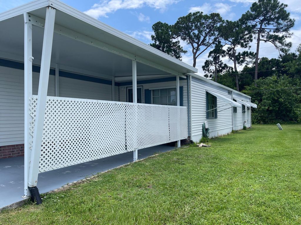 Photo of 15 SE La Mesa, Port Saint Lucie, FL 34952 (MLS # R10947195)