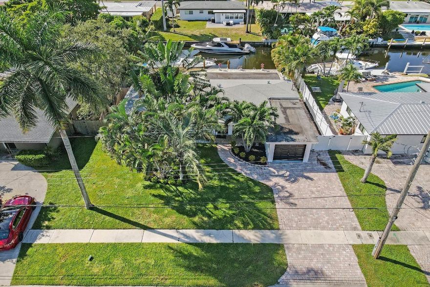 Beautifully updated waterfront home offering true South Florida living. Situated on an ocean access canal with no fixed bridges, this property features a bright open layout, updated finishes, and excellent natural light. Enjoy indoor-outdoor living with a private pool, serene canal views, and ideal boating potential. This waterfront home delivers the full South Florida lifestyle, highlighted by a spacious backyard, private pool, and tranquil ocean-access canal with no fixed bridges. The outdoor area is ideal for entertaining, relaxing, or enjoying boating and water activities, with wide water views and a peaceful setting that feels like a private retreat.Inside, the home features a bright and open layout with clean lines, neutral finishes, and excellent natural light throughout. Living and dining areas flow seamlessly, creating a comfortable and functional space for everyday living or hosting guests. Bedrooms are well-sized and thoughtfully arranged, offering flexibility for family, guests, or home office use.The property’s design emphasizes indoor-outdoor living, allowing easy access to the backyard and pool area from the main living spaces. Whether enjoying quiet mornings by the water or hosting gatherings, this home offers versatility, comfort, and lifestyle appeal. Conveniently located near major highways, shopping, dining, beaches, and downtown Fort Lauderdale, this property is well suited for full-time living, seasonal enjoyment, or investment potential.Buyer to verify all information, including waterway access and property features.