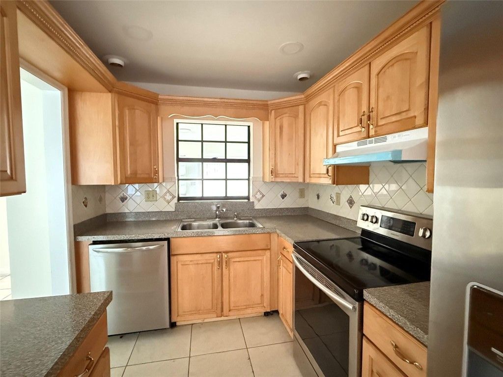 Photo of 321 W 21st Street, Riviera Beach, FL 33404 (MLS # F10530832)