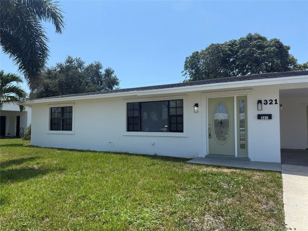 Photo of 321 W 21st Street, Riviera Beach, FL 33404 (MLS # F10530832)