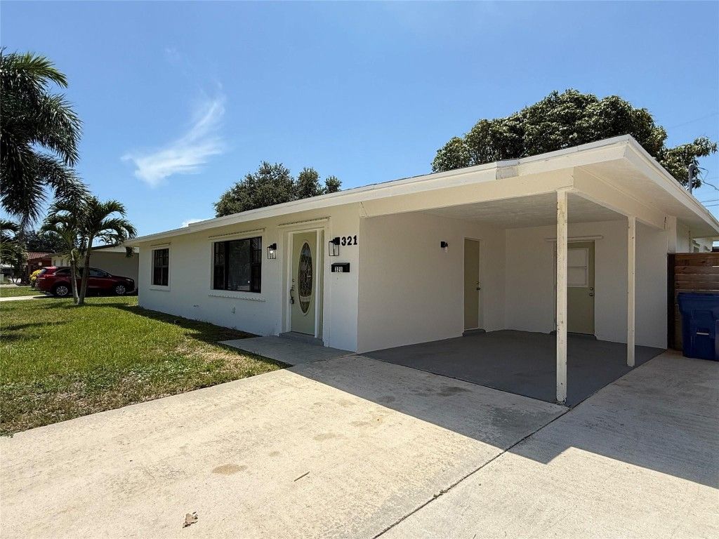 Photo of 321 W 21st Street, Riviera Beach, FL 33404 (MLS # F10530832)