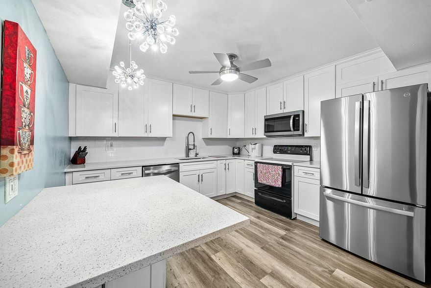 Welcome home to this move-in ready renovated villa located in the highly desirable gated 55+ community of Rainberry Bay in Delray Beach. Perfectly positioned on a private corner lot, this light-filled 2-bedroom, 2-bath residence offers a spacious and functional split-bedroom layout designed for both comfort and privacy. Featuring generous living spaces, large sliding glass doors, and an abundance of natural light throughout. The updated kitchen showcases white shaker cabinetry, sleek countertops, and modern appliances, while both bathrooms have been tastefully renovated. The expansive primary suite easily accommodates a king-size bed and features a large walk-in closet for optimal storage. Enjoy enhanced indoor-outdoor living with a glass-enclosed, air-conditioned patio... Adding approximately 140 square feet of additional living space—ideal for a sunroom, office, or sitting area—along with an open-air patio perfect for soaking up the Florida sunshine or entertaining guests.  Rainberry Bay offers a vibrant, resort-style lifestyle with an impressive array of amenities including a clubhouse with fitness center, theater, arts & crafts studio, and a full calendar of social activities. Residents enjoy five heated pools, tennis and pickleball courts, bocce ball, scenic walking and biking trails, and a picturesque lake surrounded by lush landscaping.  Ideally located just minutes from Downtown Delray Beach, Atlantic Avenue's renowned dining and shopping, and pristine South Florida beaches, this home offers the perfect balance of convenience, community, and coastal living. Whether you're seeking a full-time residence or a seasonal retreat, this property delivers exceptional value and lifestyle.  DISCLAIMER: Information published or otherwise provided by the listing company and its representatives including but not limited to prices, measurements, square footages, lot sizes, calculations, statistics, and videos are deemed reliable but are not guaranteed and are subject to errors, omissions or changes without notice. All such information should be independently verified by any prospective purchaser or seller. Parties should perform their own due diligence to verify such information prior to a sale or listing. Listing company expressly disclaims any warranty or representation regarding such information.