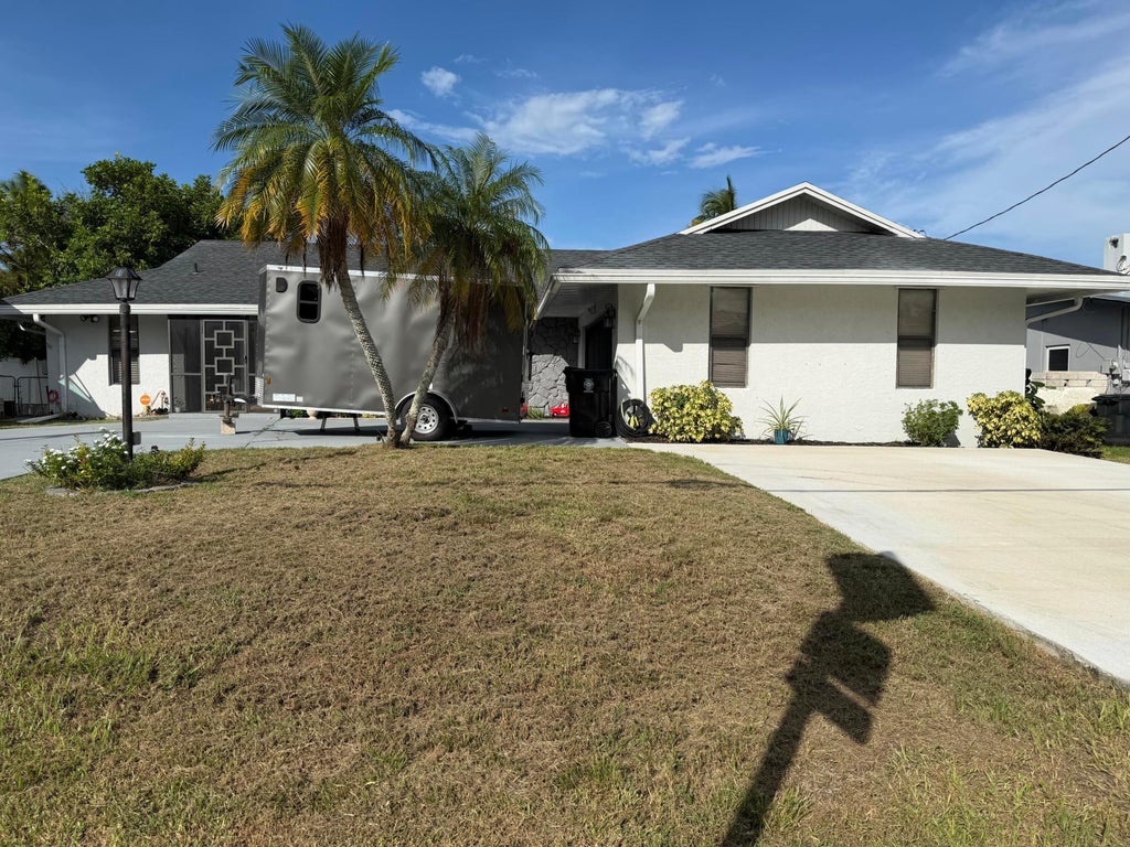 Photo of 1219 SE CORAL REEF Street, Port Saint Lucie, FL 34983 (MLS # B26077937)