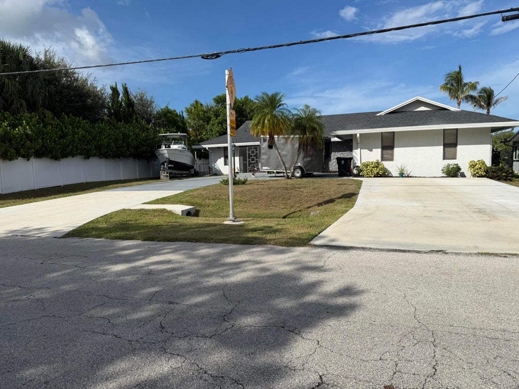 Photo of 1219 SE CORAL REEF Street, Port Saint Lucie, FL 34983 (MLS # B26077937)