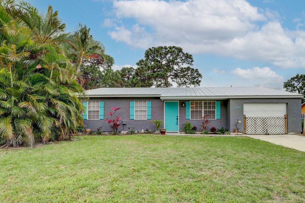 Photo of 2502 SE Robin Circle, Port Saint Lucie, FL 34952 (MLS # R10790221)