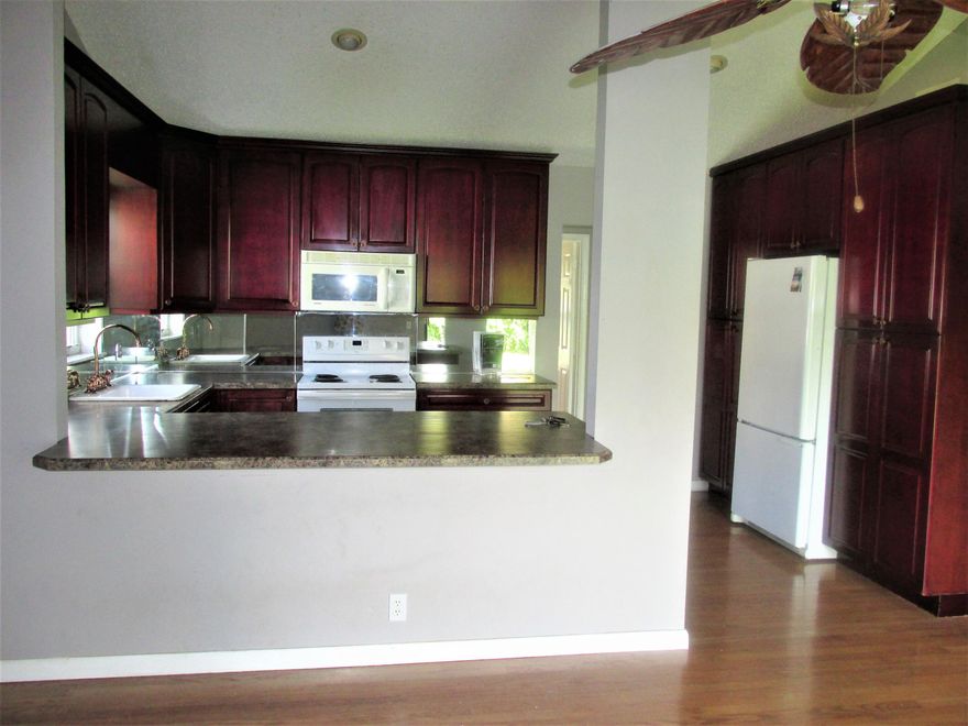 Fantastic Home with many upgrades,great neighborhood located in A schools, Low HOA district. Features Oak Wood floors in living area,cherry wood kitchen cabinets, High Hats, Tray ceiling in living room with french doors that lead out to spacious screened porch, Oversize yard with well sprinkler. Desirable Lakes of Sherbrooke with low maintenance fee of $141 monthly which includes cable tv, internet and recreational facility. Excellent schools; walking distance to Woodlands Middle School and nearby bus stops. Shopping and restaurants also nearby. Buyer is responsible for capital contribution of $500 at closing. Owner Will Consider All Reasonable offers!