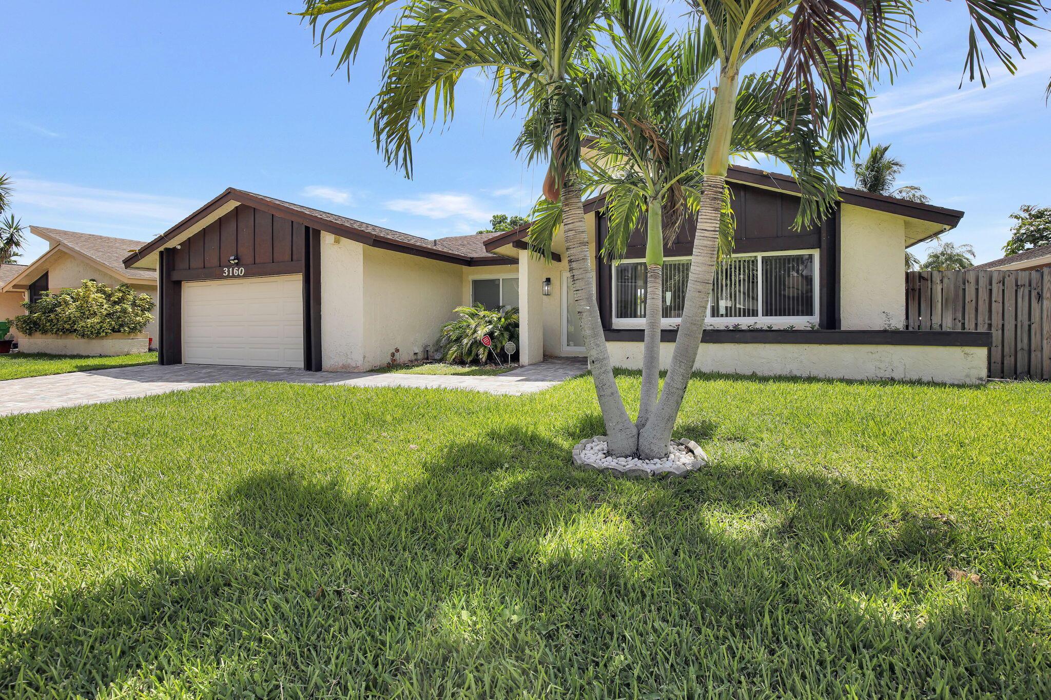 Step into comfort & convenience in one of the area's most sought-after communities, just minutes from major highways, making your commute a breeze. This beautifully maintained home boasts soaring ceilings, hurricane-impact windows, & an abundance of natural light that fills every room. The open-concept kitchen features modern stainless-steel appliances, perfect for both everyday living and entertaining. The spacious living room offers a welcoming atmosphere, while the separate family room, enhanced with elegant crown molding, high ceilings provides an inviting space for relaxation or events. Enjoy Florida living at its finest in the spacious, fully fenced backyard, complete with pavers, ideal for outdoor dining, relaxing, or hosting gatherings. Don't miss your chance to make it yours!
