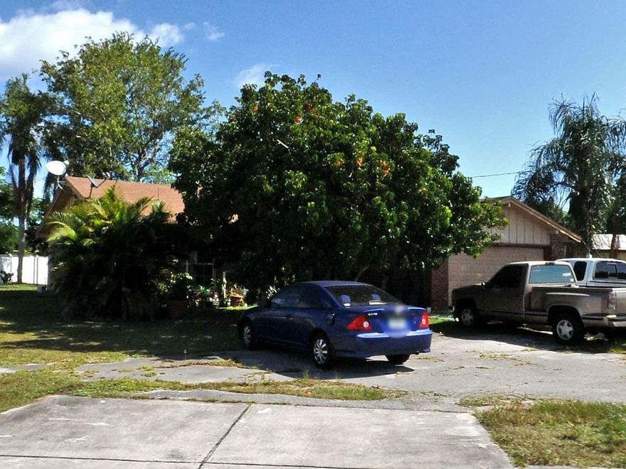 COMMERCIAL POTENTIAL!!!  Corner lot on Prima Vista Blvd 2 entrances.  Circular driveway.   Handy man special! Large, oversized pie shaped lot!!! Near other businesses.CASH ONLY!!! 12k plus square foot lotSeller will absolutely do no repairs.   Sold AS-IS buyer may inspect all measurements are estimates.