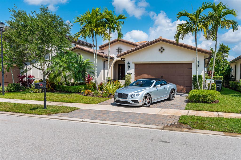 Beautiful 1-story home located on a prime lot with wide water views in a great neighborhood around A+ schools.This 4-bed/3-bath SMART home includes an open floor plan. Completely upgraded home by electronic devices for maximum efficiency. With simply one click on your smart phone/tablet you can control everything: 'security system, door lock, lights, pool lights, spa, fans, thermostat & more...' these systems will save you time & money. Remodeled bathrooms & kitchen including a huge waterfall edge island countertop & gas cooking range.New recessed lights, a new outdoor summer kitchen & a huge new outdoor closed screen patio with mosquito misting system. Come&entertain family & friends in your heated salted water pool & spa surrounded by a beautiful tropical landscape overlooking the lak