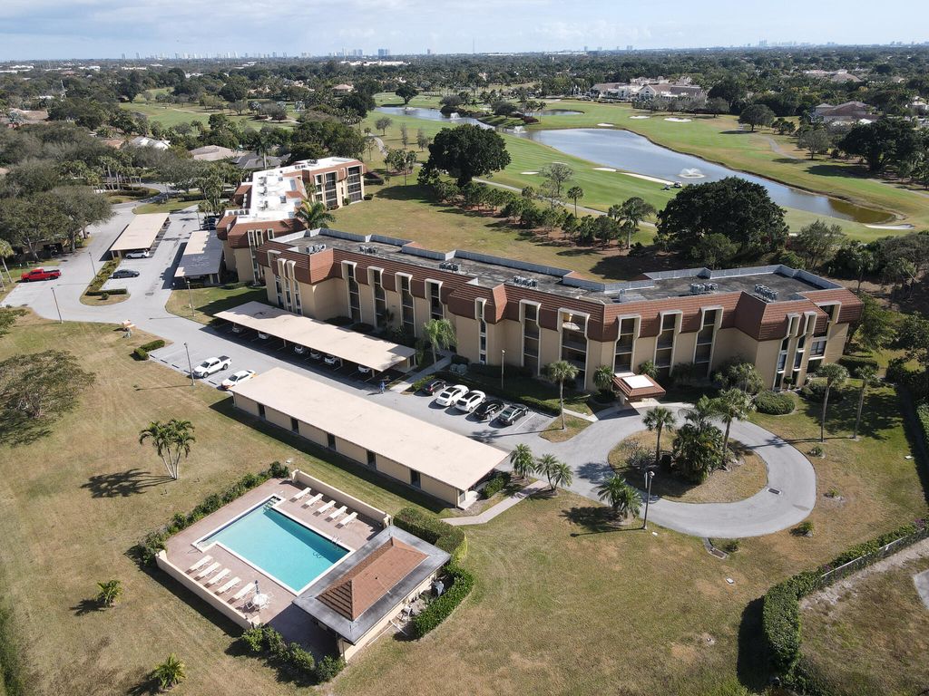 Photo of 5390 Woodland Lakes Drive #201, Palm Beach Gardens, FL 33418 (MLS # R11161896)