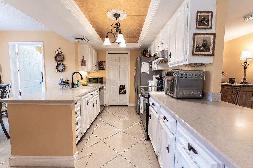 Photo of 5390 Woodland Lakes Drive #201, Palm Beach Gardens, FL 33418 (MLS # R11161896)