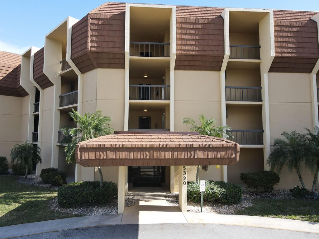 Photo of 5390 Woodland Lakes Drive #201, Palm Beach Gardens, FL 33418 (MLS # R11161896)