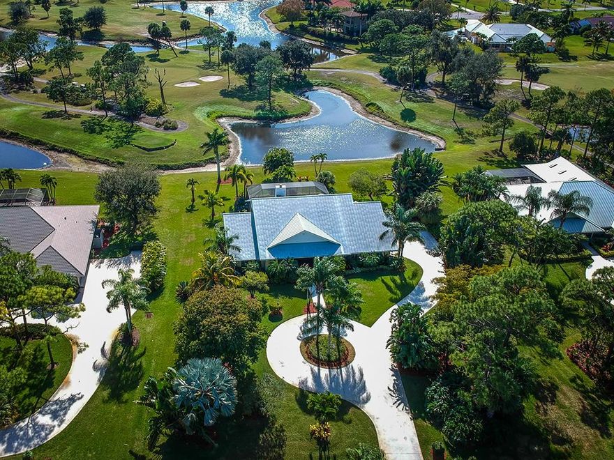 Exquisite Key West style solid CBS 3BR plus den/3BA/3CG, metal roof, screened pool home w/summer kitchen and picturesque golf course & lake views where not one detail was left unturned. This magnificent opportunity offers completely updated chefs kitchen with top of the line SS appliances, Silestone quartz countertops, custom cabinetry w/pull-out drawers, built-ins, & designer hardware. The new owner will also take privy to 3 renovated full bathrooms; hardwood floors, gas-burning fireplace, designer fixtures, newer AC, all new ductwork in attic, newer pool heater, interior & exterior paint AND newer pool resurfacing & patio area resealed. Pride of home ownership shows throughout this buying opportunity at The Evergreen Club. Low HOA fees includes 24hr manned gated security & basic cable. A+Rated Palm City Schools.