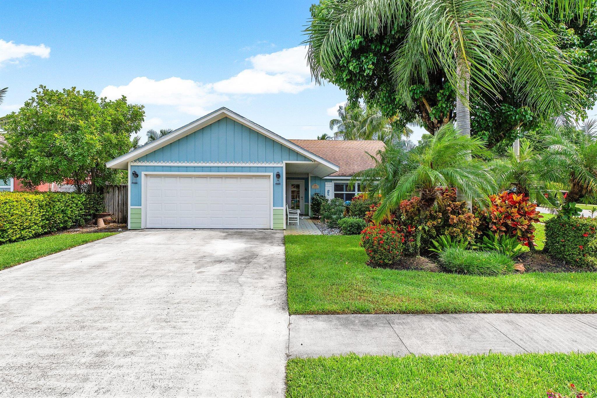 Fully Renovated 2-Bedroom Plus Den in Prime Boynton Beach Location! This move-in ready coastal-style home just minutes from the beach, downtown Boynton Beach, and Atlantic Ave in Delray. This beautifully updated property features hurricane-impact windows & doors, new Hardie Board siding, fresh coastal paint, and a 2022 enclosed screened sun porch. Inside, enjoy vaulted tongue-and-groove ceilings, wood-look floors, and a bright, open layout. The gourmet kitchen boasts Vetrazzo recycled glass countertops, GE Cafe induction range, Bosch dishwasher, and Medallion cabinetry. Both bathrooms are luxuriously remodeled with designer tile, vessel sinks, and frameless glass showers. Additional highlights include a versatile den/office, large laundry room, lush landscaping, and upgraded LED lighting.