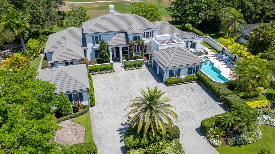 Completely renovated and ultra-private, this stunning estate on Maidstone Drive offers 5 bedrooms plus a separate, fully equipped 1-bedroom guest cottage. The spacious primary suite features a serene sun porch, while all three upstairs bedrooms boast their own private balconies. Perfect for entertaining or family living, it features a large pool area, lush landscaping, a striking live wall, and all impact glass throughout. Feels like a private resort—luxury, comfort, and style in the exclusive Palm Beach Polo and Country Club.