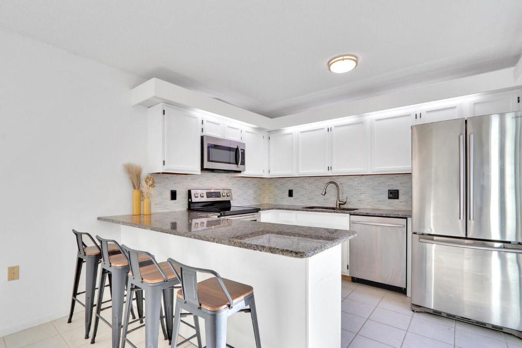 Photo of 5633 SE Windsong Lane, Stuart, FL 34997 (MLS # R10968317)