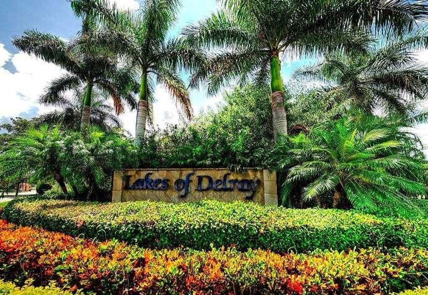 LOWEST PRICED 2/2 IN ENTIRE COMMUNITY.  Light & Bright 1ST FLOOR CORNER updated unit with air conditioned Florida room.  GORGEOUS LAKE VIEWS, separate master suite and laundry room.  Lakes of Delray is a 24-hour man-gated ACTIVE ADULT community with tons of amenities & activities incl. shows, fitness center, SPA, clubs & classes, tennis, pickle ball, and a huge RESORT STYLE HEATED POOL & JACUZZI.  Less than 5 miles to WORLD FAMOUS ATLANTIC AVENUE restaurants, beach, and nightlife.  PRICED TO STEAL!