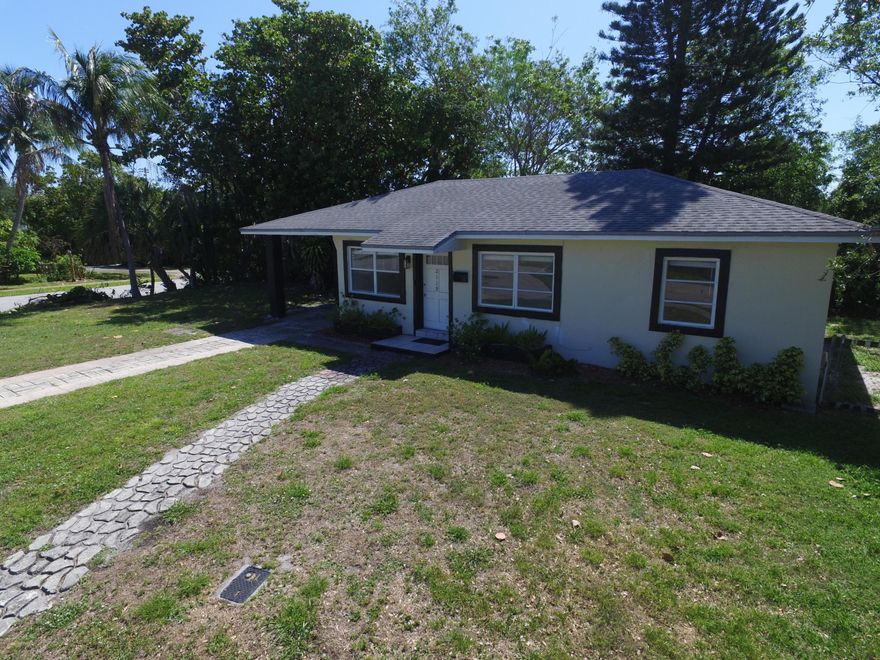 Completely renovated & move-in ready! This charming 3-bedroom, 1-bath single-family home offers 962 square feet under-air of newly renovated living space including updated flooring, a modern kitchen with contemporary cabinetry and countertops, and a freshly tiled bathroom. Every room gets ample natural light, making this home feel both comfortable and functional.   Conveniently located close to Pineapple Grove & Atlantic Ave. the heart of Delray Beach, this location can't be beat. Corner lot of intersecting quiet residential streets, the property provides easy access to local shopping, dining, beaches, and transit routes. The spacious yard and plenty of off street parking offers room to relax or entertain, while the fresh renovations ensure a clean, low-maintenance living experience.