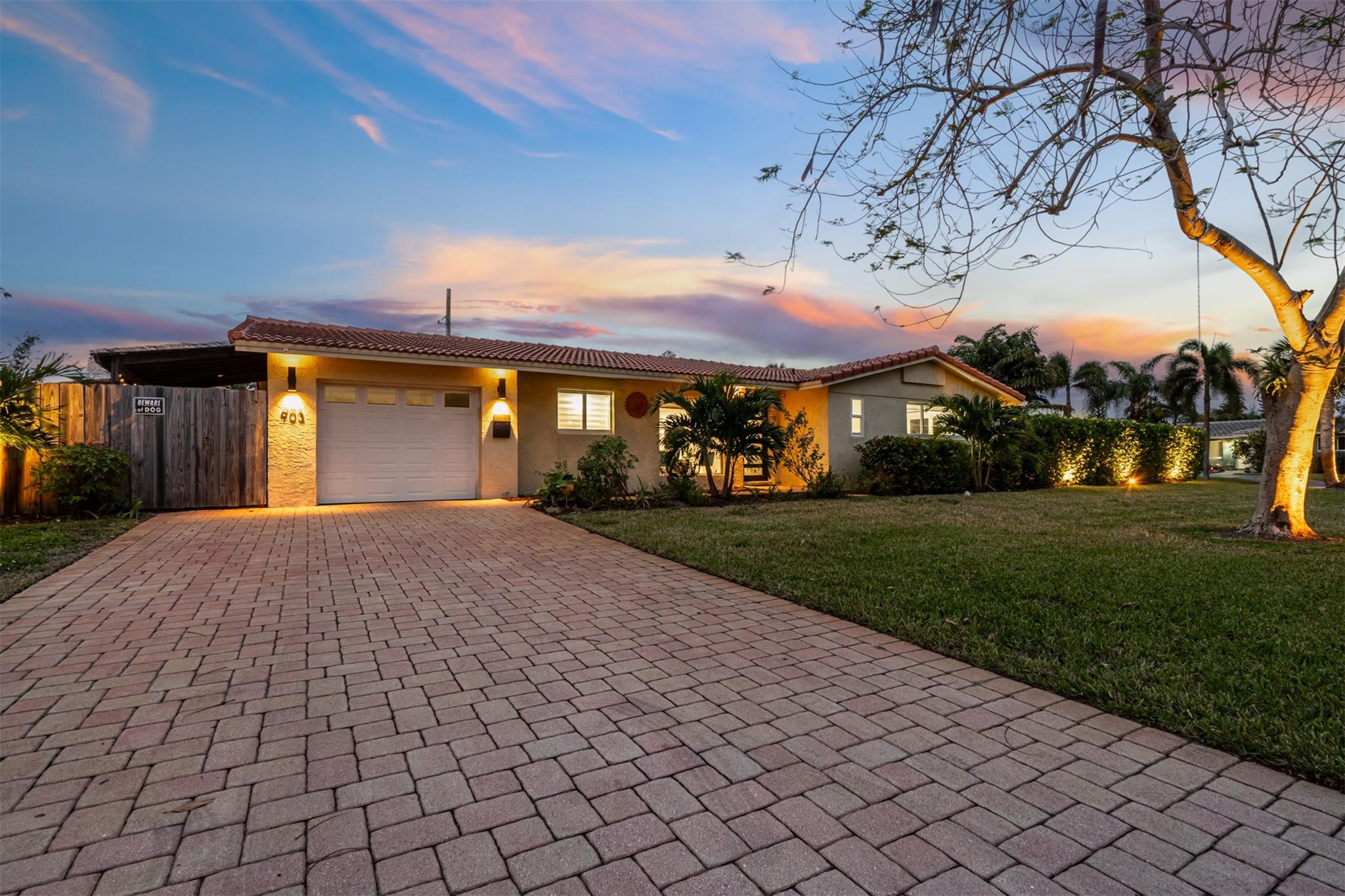 Just minutes from the beach, this renovated fully furnished 3 bedroom, 2 bath home sits on a fully fenced large corner lot in The Cove, one of the area’s most desirable neighborhoods. Featuring two spacious king bedrooms with memory foam mattresses, a third bedroom with four twin beds, modern baths, and an open kitchen with stainless steel appliances, coffee bar, island and dining for 8. The bright living area offers plush seating and a large TV. Outdoors you can enjoy a heated pool, tiki bar, loungers, sun umbrella, and outdoor dining for 8, perfect for entertaining or relaxing with family and friends. Conveniently close to the beach, pier, Sullivan Park, shopping, dining, nightlife and major roads with easy access to Boca Raton, Fort Lauderdale and Palm Beach. A must-see luxury retreat!
