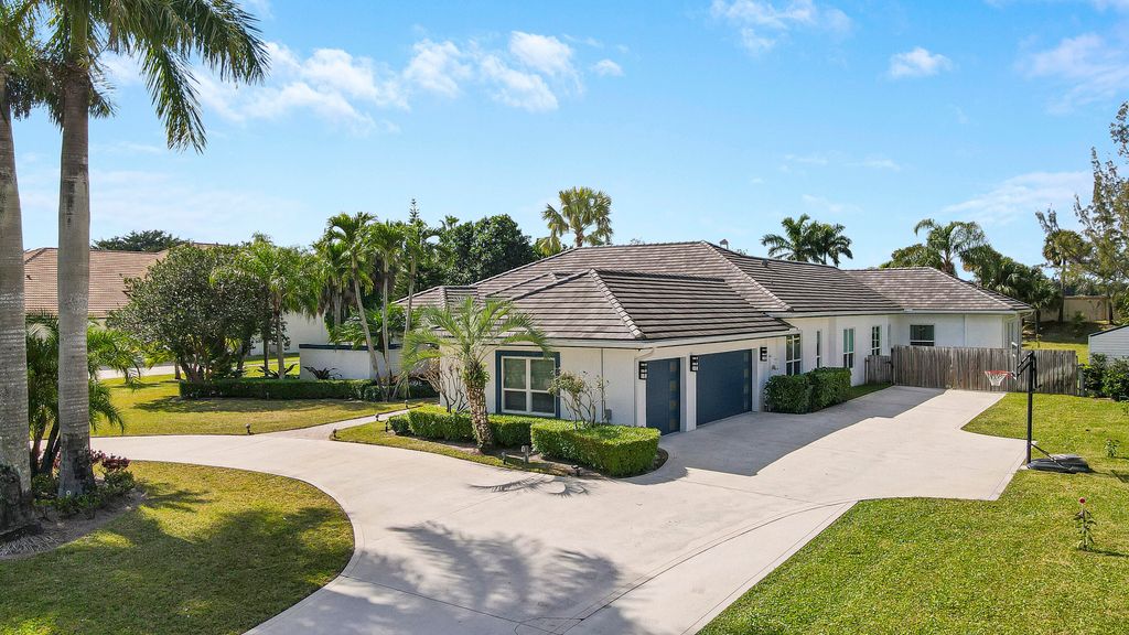 Photo of 8369 Man O War Road, Palm Beach Gardens, FL 33418 (MLS # R10971945)