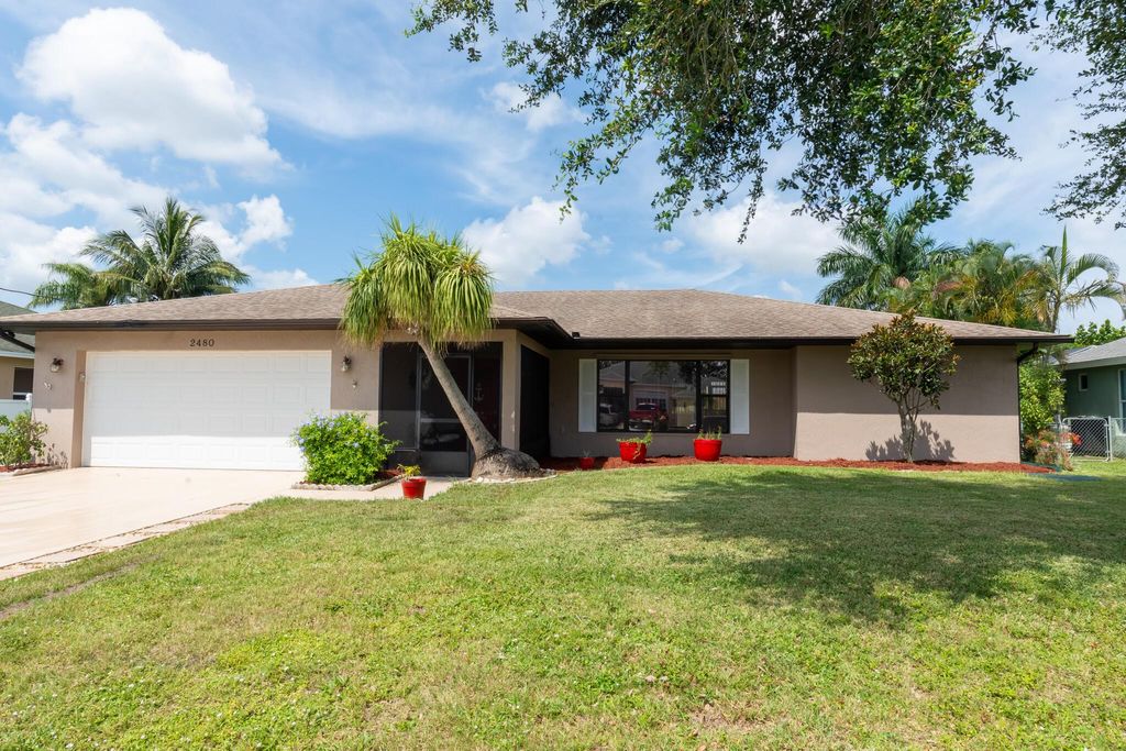 Photo of 2480 SW Monterrey Lane, Port St Lucie, FL 34953 (MLS # R10901978)
