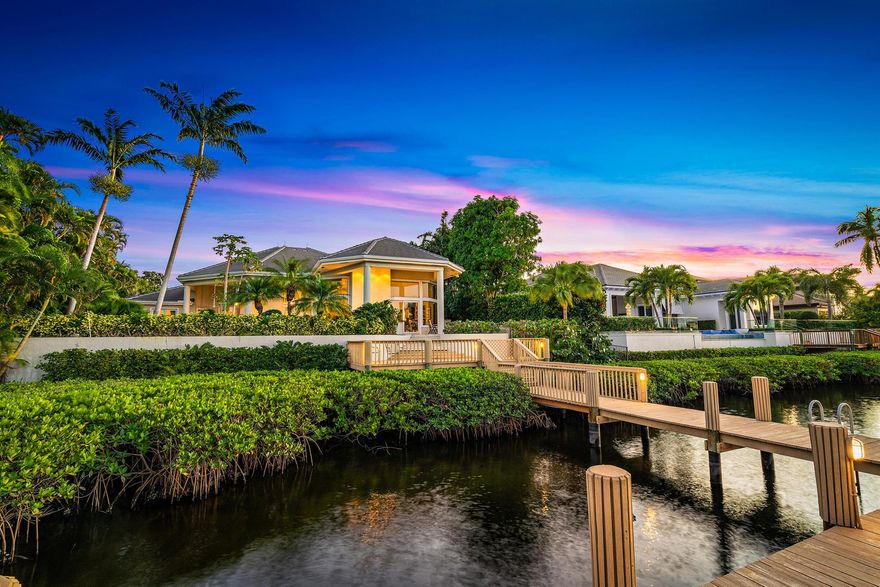 Waterfront Estate Home in desirable Admirals Cove.  This contemporary home boasts large bedrooms, 2 - 2 car garages, NEW ROOF in 2021, granite kitchen, custom cabinets, large office/den with built - in book shelves,  generator, custom ceiling and art niches, over-sized primary suite with separate sitting or exercise room, luxurious bath and doors to the outdoor space.  Relax or entertain around the pool and patio with views of the interior waterways that is within minutes of the Intracoastal. Admirals Cove has 45 holes of golf, pickleball and tennis courts, fully staffed marina, state of the art Spa and Salon - there is never a reason to leave.