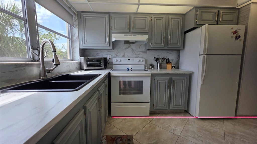 Photo of 4047 NW 16th St #302, Fort Lauderdale, FL 33313 (MLS # F10535359)