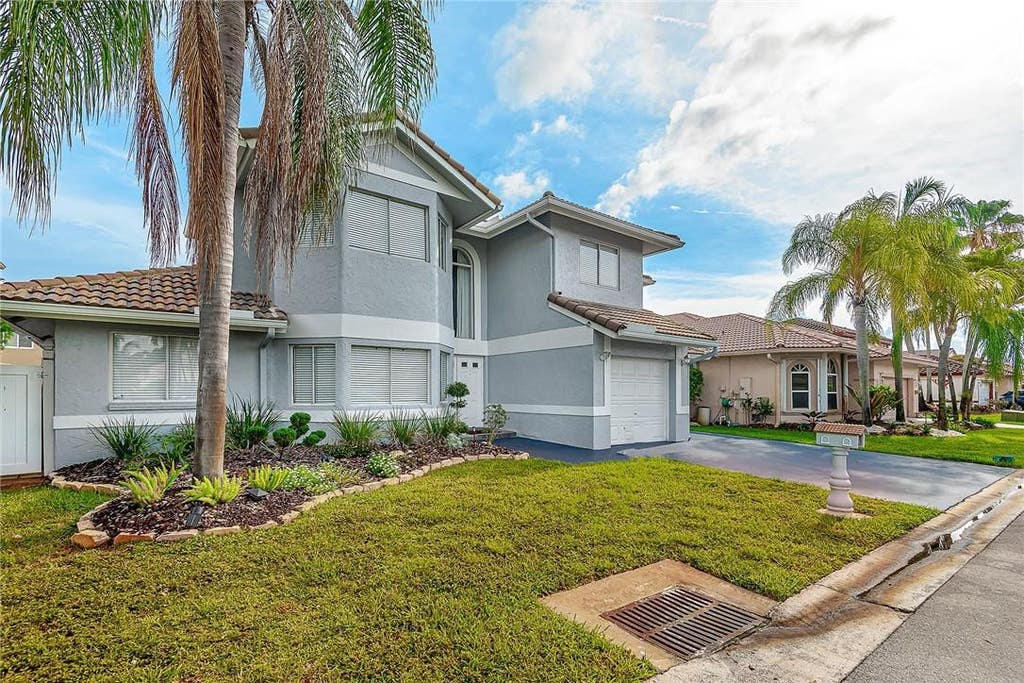 Photo of 11551 SW 11th Street, Pembroke Pines, FL 33025 (MLS # B26068229)