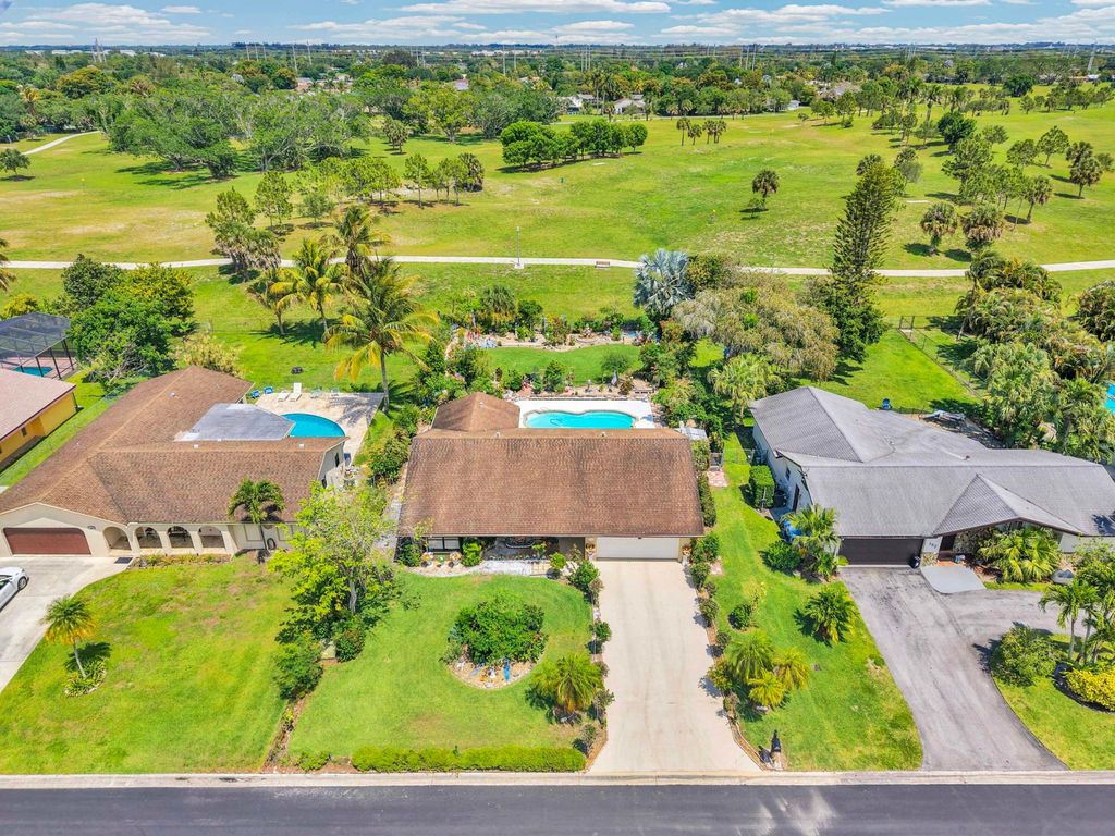 Photo of 164 Meadowlark Drive, Royal Palm Beach, FL 33411 (MLS # B26021568)