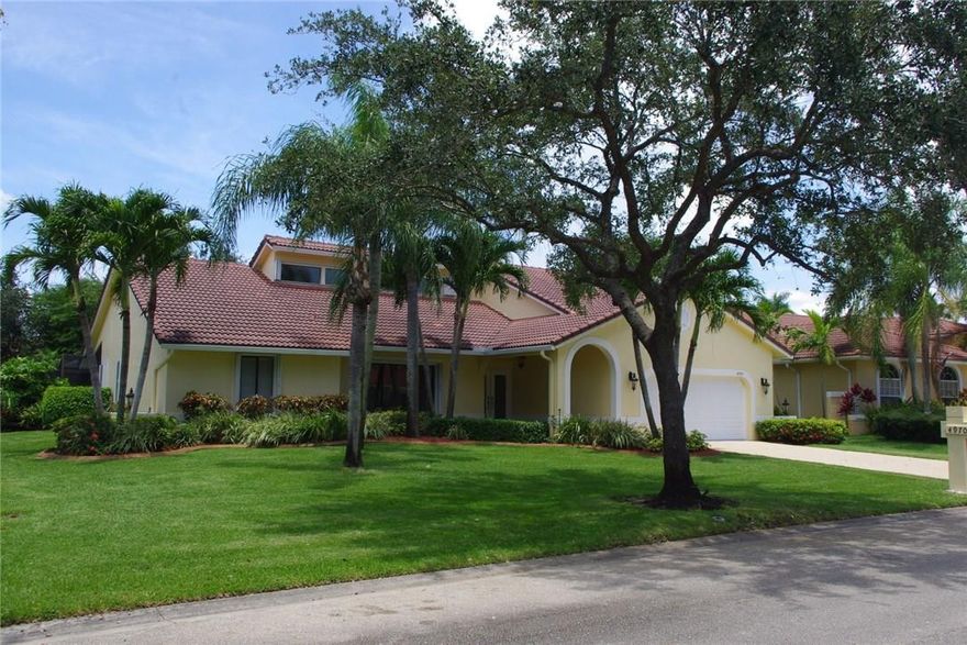 BROOKSIDE GROVE well maintained 4BD 2.5BA on a large lot in beautiful "estate area" of Brookside, split floor plan, vaulted ceilings, remodeled kitchen, granite counters, SS appliances, newly painted inside & out, plenty of natural lighting, porcelain tile flooring through out, newer a/c, tile roof, accordion shutters, enclosed screened pool with covered patio, grass yard with tropical landscaping and trees. Low maintenance fee, top-rated schools, near North Community & Betti Stradling recreational parks.