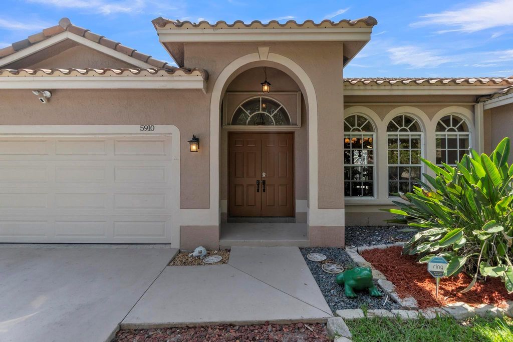 Photo of 5910 NW 40th Lane, Coconut Creek, FL 33073 (MLS # F10502955)