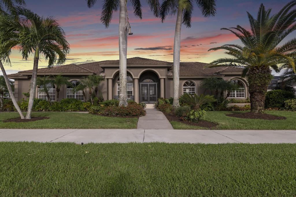 Available for the first time, this sensational boater's estate is set on Marco Island - one of the most exclusive and in-demand locations in all of Southwest Florida.This Mediterranean, waterfront custom built Divco home is nestled on a highly desirable .36 acre lot boasting long canal views. With a private dock and easy access to the Gulf of Mexico, this property will appeal to fishing and leisure boating enthusiasts alike. Dock space includes: a 16,000 lb Aluminum boat lift that accommodates up to a 36ft boat, (2) 1,000 lbs jet ski lifts, and space for an 18ft flats boat w/ 2 davit lifts. There's even a built-in station for cleaning fish and room for yet another outdoor dining setup, where you can enjoy the day's catch or admire the sunset (and your vessel, of course).