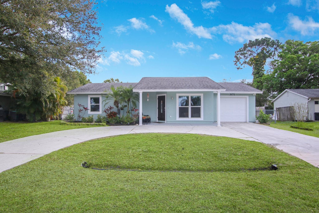 Photo of 3171 SW Crumpacker Street, Port Saint Lucie, FL 34953 (MLS # R10779163)