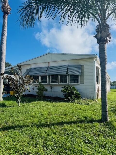 COME SEE THE ONE YOU HAVE BEEN WAITING FOR!!! THIS two bedroom, two bath mobile home is SITUATED IN the wel seek after SPANISH LAKES GOLF VILLAGE. . Enjoy the Florida room and the serene covered backyard patio with breathtaking water views. Situated IN a vibrant 55+ community WHERE THERE IS Golfing swimming pool ,clubhouse activities and much more. in the heart of Port St. Lucie, you'll have access to a wealth of   much more activities and amenities.