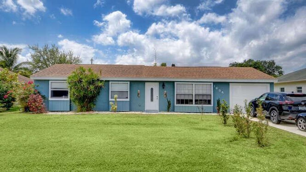 Photo of 1634 SE Sandia Drive, Port Saint Lucie, FL 34983 (MLS # R10708144)