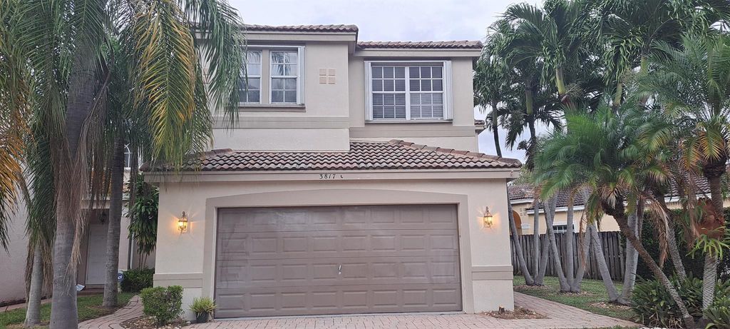 Photo of 3817 NW 62nd Street, Coconut Creek, FL 33073 (MLS # R10943174)