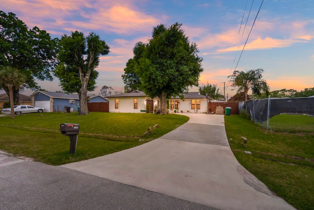Photo of 1720 SW Beeker Street, Port Saint Lucie, FL 34953 (MLS # B26017554)
