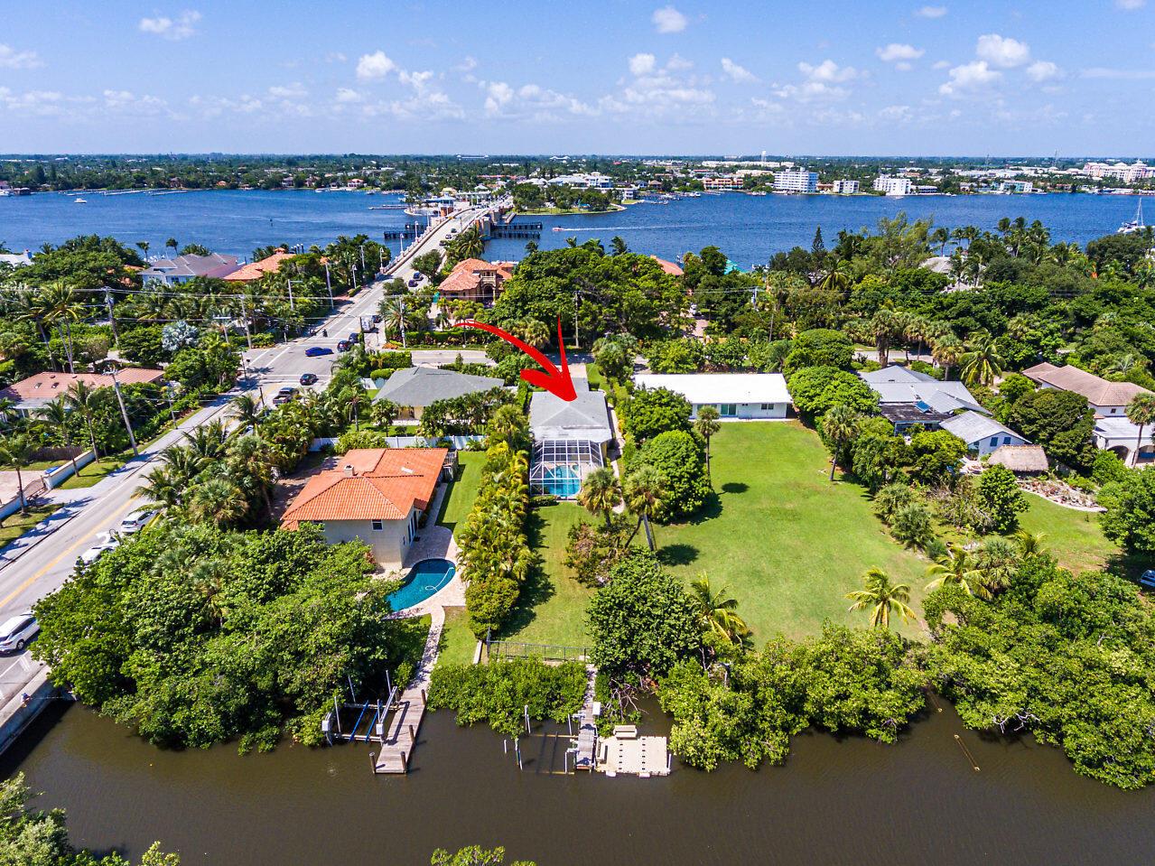 **COASTAL LIVING** WALKING distance to BEACH, grocery store, restaurants, walk paths. This beautiful 4 bedroom, 3 Full Bath waterfront / Pool Home is offered FULLY FURNISHED. Kitchen boasts Gas Range, Stainless Appliance, Granite Countertops, Bar Area / Breakfast Area. Marble & Tile Flooring throughout. Impact Windows. Entertain outdoors under the lanai listening to the Waterfall overflowing into the heated Pool / Spa. Step outside to a oversized backyard with lush landscaping onto your own private dock overlooking the Nature Preserve. Floating Dock Removed. Refrigerator and and driveway have been replaced & Decorations / linens have changed since photos taken.