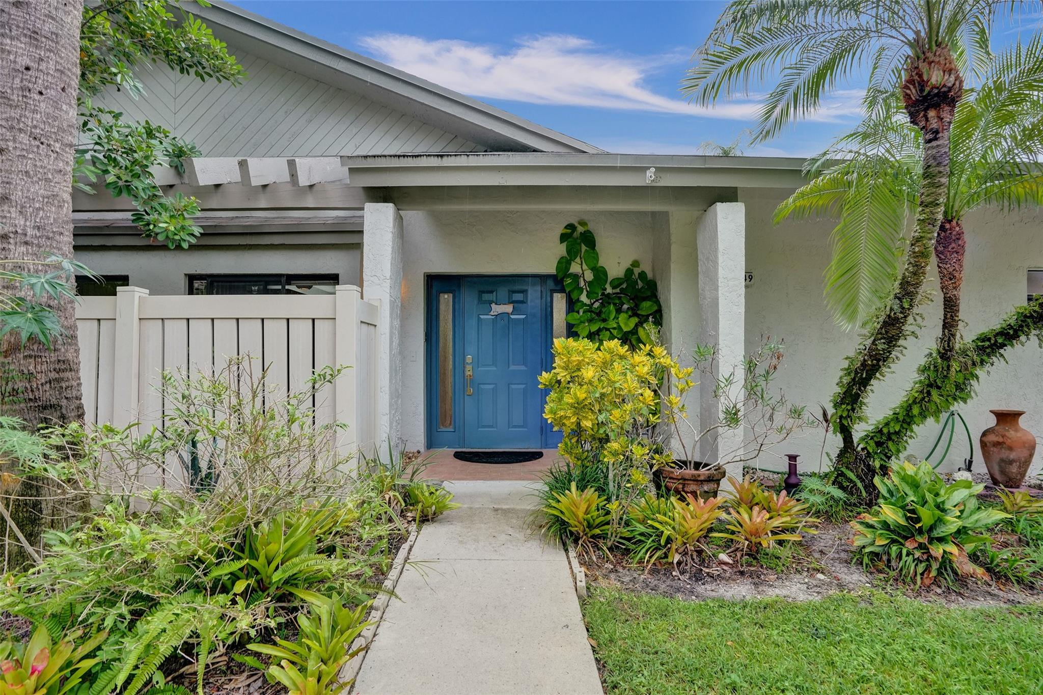 A Great Value ! CORNER ONE STORY VILLA in desirable "Baywood Village II in The Township" 2-BR, 2-BTH featuring NEUTRAL TILE FLOORS, FRESHLY PAINTED NEUTRAL INTERIOR; OPEN CONCEPT LR/DR & WHITE PLANTATION SHUTTERS. Split bedroom plan offers privacy, both with LARGE WALK IN CLOSETS. Spacious EAT IN KITCHEN overlooks the garden with STAINLESS APPLIANCES, AMPLE CABINETRY & COUNTER SPACE & OVER-CABINET LIGHTING. *Master bath with UPDATED WALK IN SHOWER* FULL SIZE WASHER/DRYER. ***2021-2022 ROOF, 2013 WATER HEATER & 2016 AC***Enjoy a large screened lanai perfect for relaxing or entertaining. ALL AGES ACTIVE COMMUNITY with clubhouse, pool, and more. Assigned parking space + guest spaces in front. Centrally located near shops, dining & highways—yet tucked away from the noise. PRICED TO SELL!